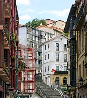 City landscape of a small, cozy street with cascaded houses in Bilbao