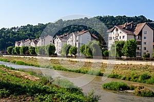 City landscape with Tarnava Mare River and blocks of flats in the center of Sighisoara, in Transylvania Transilvania region,