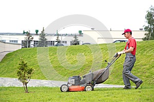 City landscaper cutting grass