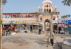 City life with pedestrians and some stores on indian town street