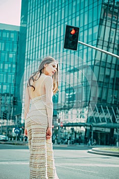 City life. Woman in modern town. Fashion street style vogue. Fashionable girl walking on streets.