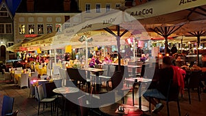 City night life street cafe tables people dinner pink light on table Lifestyle Travel Restaurant City Light Old Town Tallinn ,