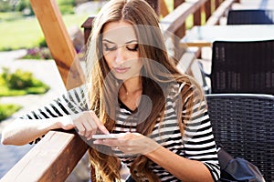 City lifestyle woman using smartphone on cafe