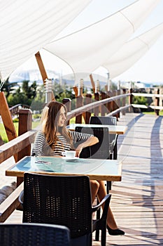 City lifestyle woman using smartphone on cafe