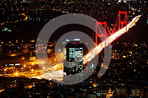 City light and night view above Istanbul, Turkey. Bosphorus bridge.