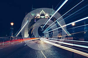 City light trails of traffic on Tower Bridge London at night