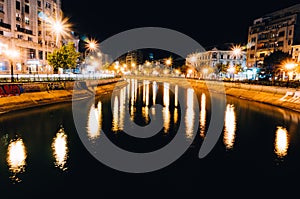 City lights reflected in river