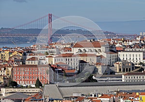 City of Lisbon with the the Lisbon side of the `25th of April Bridge` crossing the River Tagus in the background.