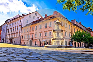 City of Ljubljana fountain on sun beams and street architecture