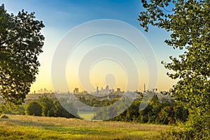 The City of London Cityscape at Sunrise with early Morning Mist from Hampstead Heath. Buildings include the Shard, Gherkin 30 St M