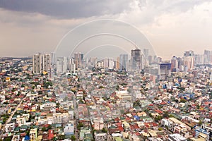 The city of Manila, the capital of the Philippines. Modern metropolis in the morning, top view. Modern buildings in the