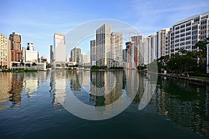 City of Miami, Florida skyline reflected in Biscayne Bay at sunrise.