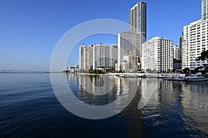 City of Miami, Florida skyline reflected in Biscayne Bay at sunrise.