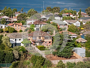 View of residential houses in Melbourne`s suburb on a hill. photo