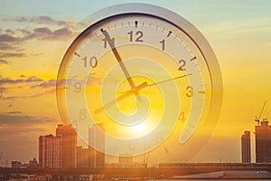 City morning new day business working time work concept. Metro sky view sun rise overlay with hours clock