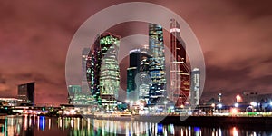 The city of Moscow at night, view from the embankment of the Moscow River to the business district. Architecture and landmark of M