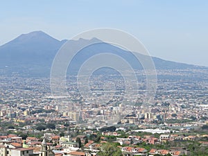 The city of Naples from above. Napoli. Italy. Vesuvius volcano behind.Orthodox church cross and the moon.