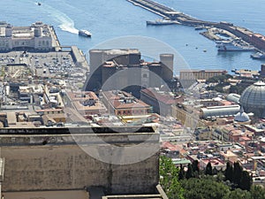 The city of Naples from above. Napoli. Italy. Vesuvius volcano behind.Orthodox church cross and the moon.