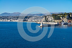 City of Nice in France, pier on Mediterranean Sea with Phare de Nice lighthouse