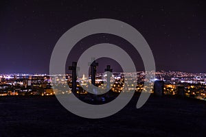 City night in Nitra from the view point on top of Hill mountain Slovak city Nitra with purple night sky and crosses. City cente