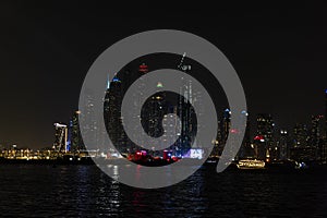 City at night, panoramic scene of downtown reflected Dubai