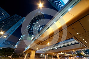 City night scene with business office skyscrapers in Hong Kong,