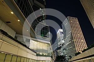 City night scene with business office skyscrapers in Hong Kong,