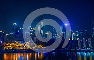 City night view of Chongqing, China.  The scenery by the river.  The fusion of modern architecture and folk architecture.  City vi