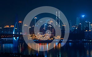 City night view of Chongqing, China.  The scenery by the river.  The fusion of modern architecture and folk architecture.  City vi