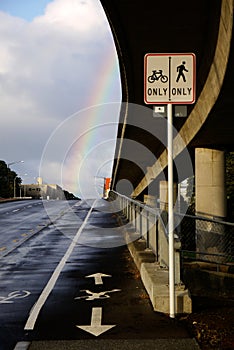 City: overpass and bike path with rainbow photo