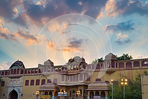 The City Palace at Jaipur, capital city of Rajasthan, India. Architectural details with scenic dramatic sky at sunset.