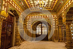 City Palace Jaipur medieval royal room with gold artwork at Rajasthan, India