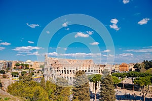 City panorama Rome, Italy Colosseum or Coliseum ancient ruins background blue sky with clouds