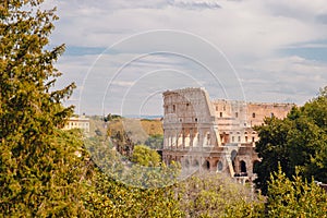 City panorama Rome, Italy Colosseum or Coliseum ancient ruins background blue sky stone arches and sunset