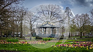 The city park in Apeldoorn called Orange Park, in early spring with blooming multicolored tulips