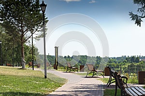 City park with benches on the embankment. Europe, Russia, Rzhev