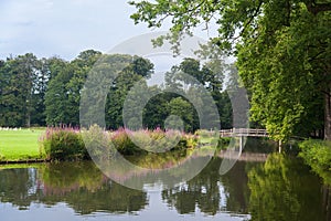 City park with bridge in summer on the Schaffelaar estate in Barneveld, the Netherlands