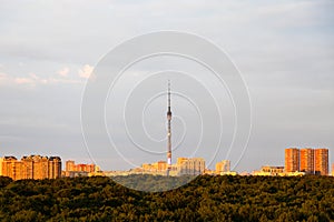 City park and high-rise houses on horizon at suset