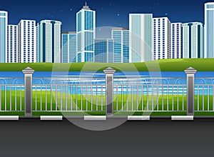City park landscape with river and urban background