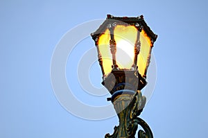 city park lights turn on in the evening