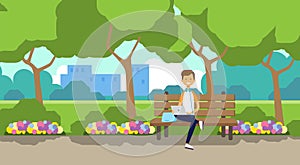 City park man holding laptop sitting wooden bench green lawn flowers trees cityscape template background flat