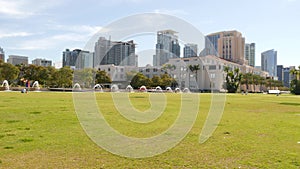 City park near San Diego county civic center in downtown, California coast, USA. Urban skyline, skyscrapers in Gaslamp Quarter.