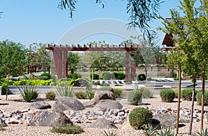 City park with vegetation and wooden Ramada