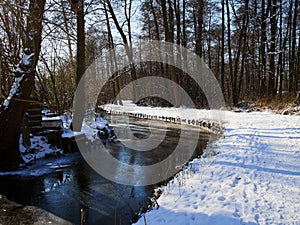 City park walking footpath covered with snow