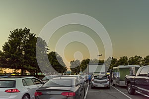 city parking with an inflatable screen of a summer cinema, waiting for a movie