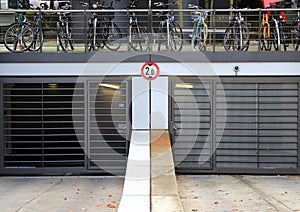 City parkinglot entrance with bicycles on top