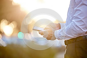 City, phone and hands of business man on morning commute for work, career and job. Corporate, professional and person