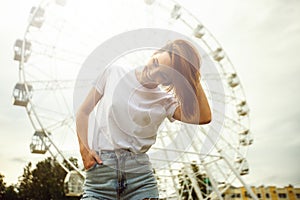 City portrait of a fashionable beautiful young girl