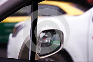 City rain drop on side windshield of car