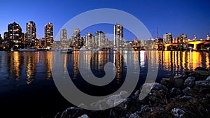 City reflection in water at night.